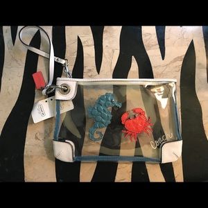 Coach beach wristlet
